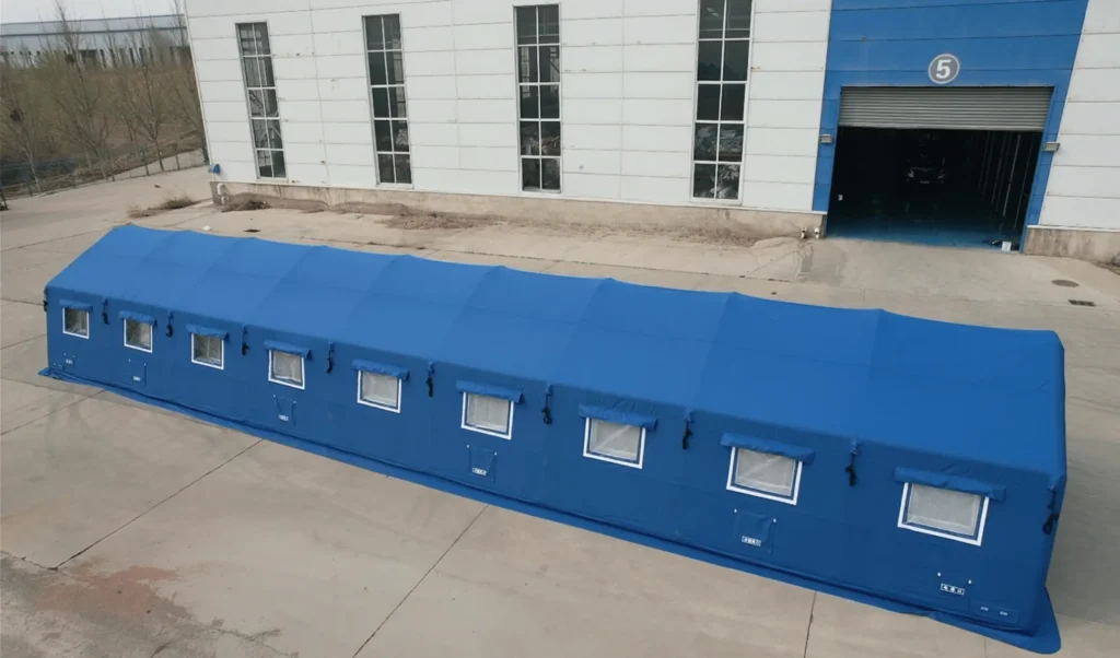 Official emergency relief shelter with enclosed walls and multiple protected window openings 
